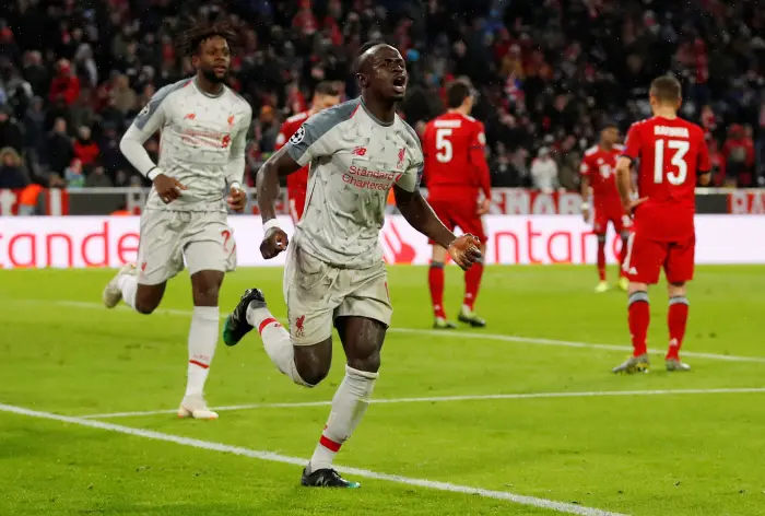 Liverpool's Sadio Mane celebrates scoring their third goal with Divock Origi