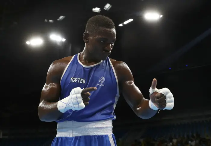 2016 Rio Olympics - Boxing - Quarterfinals - Men's Middle (75kg) Round of 16 Bout 209 - Riocentro - Pavilion 6 - Rio de Janeiro, Brazil - 15/08/2016. Christian Mbilli Assomo (FRA) of France reacts.