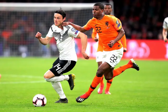, Germany player Nico Schulz and Netherlands player Denzel Dumfries