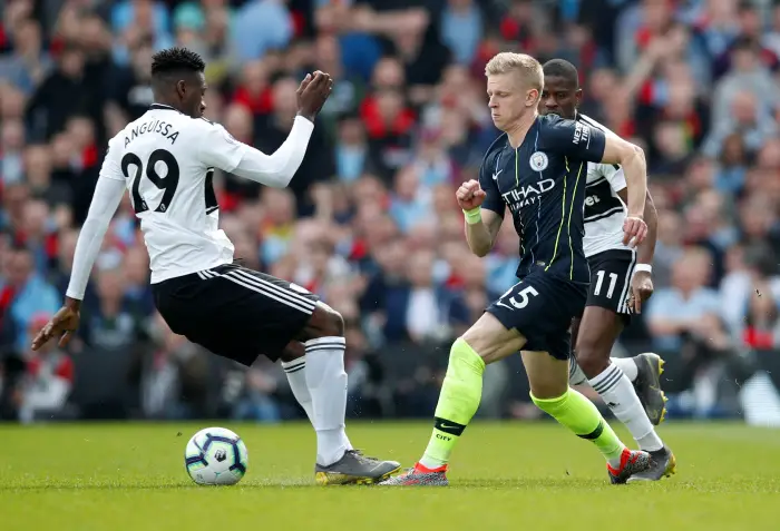 Soccer Football - Premier League - Fulham v Manchester City - Craven Cottage, London, Britain - March 30, 2019  Fulham's Andre-Frank Zambo Anguissa in action with Manchester City's Oleksandr Zinchenko
