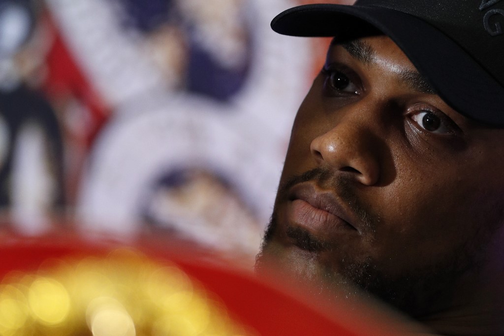 British boxer Anthony Joshua speaks during a press conference in London on February 25, 2019, ahead of his forthcoming IBF, WBA and WBO heavyweight title boxing match against US boxer Jarrell Miller - Joshua will fight in the United States for the first time when he defends his IBF, WBA and WBO heavyweight titles against Jarrell Miller at Madison Square Garden on June 1. (Photo by Adrian DENNIS / AFP)