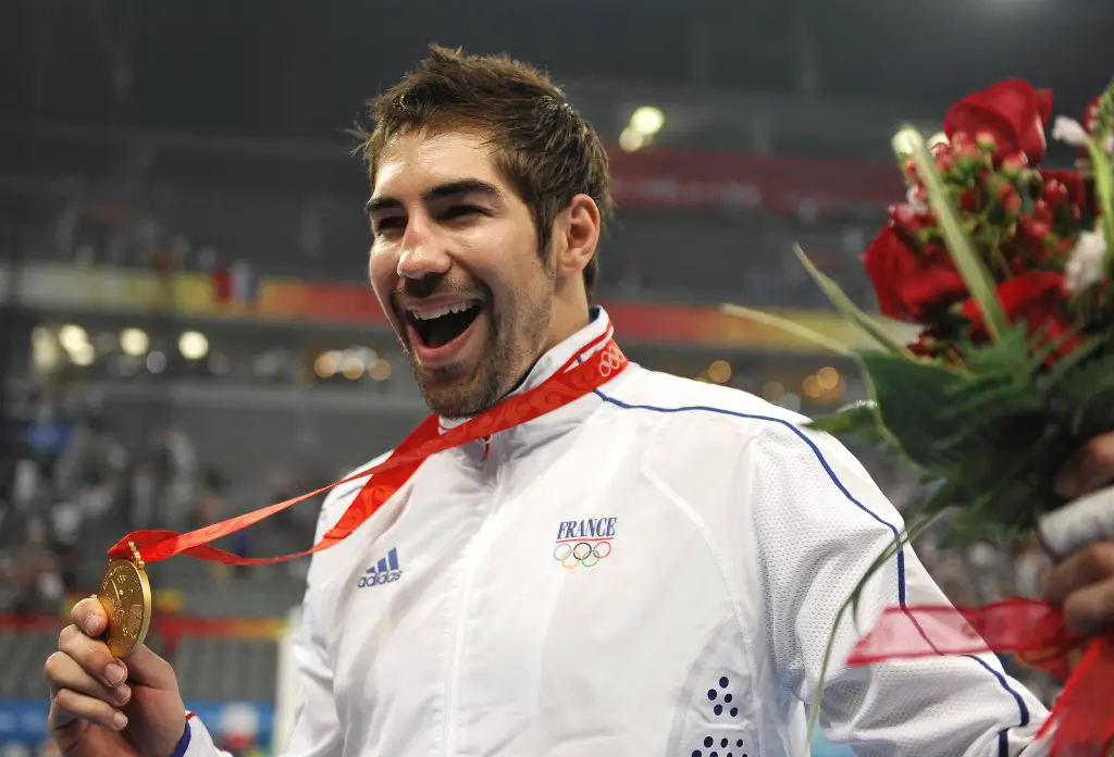 Nikola Karabatic, of the men's handball team of France, poses after receiving the gold medal of the 2008 Beijing Olympic Games on August 24, 2008 in Beijing.  AFP PHOTO / PHILIPPE HUGUEN (Photo by PHILIPPE HUGUEN / AFP)
