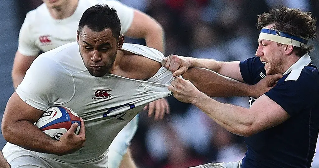 England's Billy Vunipola (L) is tackled as he runs with the ball during the Six Nations international rugby union match between England and Scotland at Twickenham stadium in south west London on March 11, 2017. (Photo by Glyn KIRK / AFP)