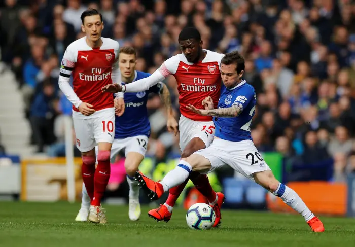 Everton's Bernard and Lucas Digne in action with Arsenal's Mesut Ozil and Ainsley Maitland-Niles