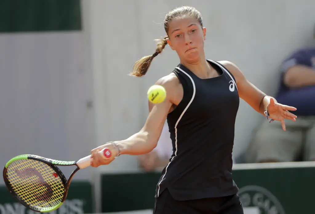 France's Diane Parry returns the ball to Slovakia's Rebecca Sramkova during the qualification round for The Roland Garros 2018 French Open tennis tournament in Paris on May 24, 2018. (Photo by Thomas SAMSON / AFP)