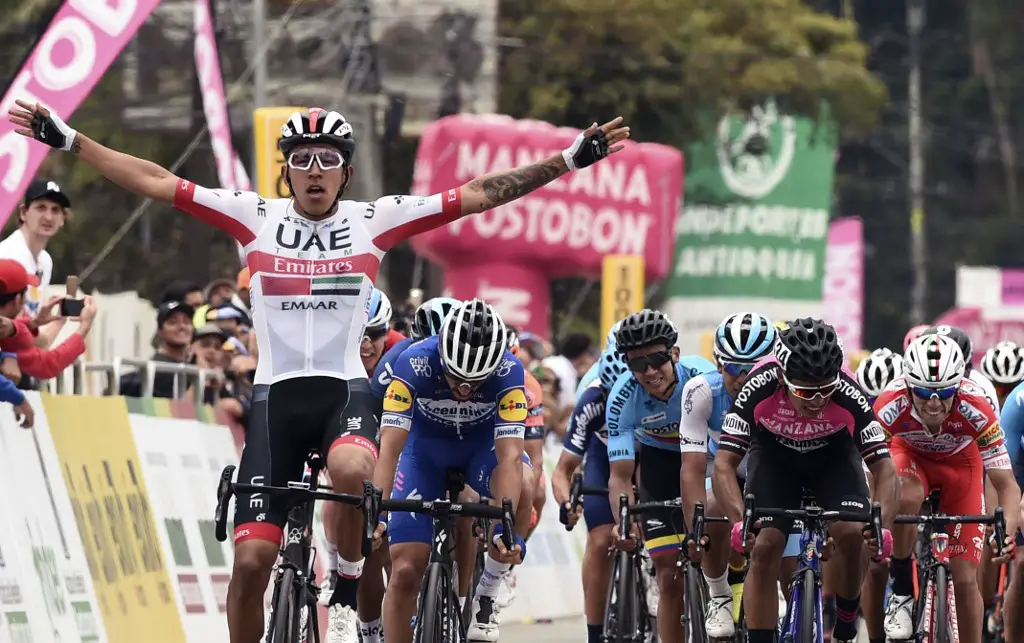 Colombian cyclist Sebastian Molano (L) of UAE Team Emirates, crosses the finish line to win the third stage of the Tour Colombia 2.1, in Rionegro, Antioquia department, Colombia on February 14, 2019. (Photo by JOAQUIN SARMIENTO / AFP)