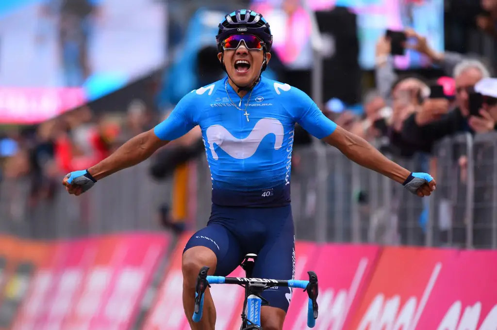 Team Movistar rider Ecuador's Richard Carapaz celebrates his victory as he crosses the finish line to win stage 14 of the 102nd Giro d'Italia - Tour of Italy - cycle race, from Saint-Vincent to Courmayeur on May 25, 2019. (Photo by Luk BENIES / AFP)