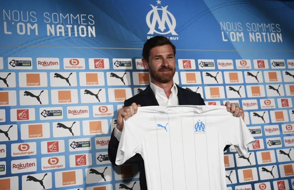 Olympique de Marseille's new coach Portuguese Andre Villas-Boas poses with a team jersey during his official presentation to the press on May 29, 2019 at the Velodrome stadium in Marseille. (Photo by CHRISTOPHE SIMON / AFP)