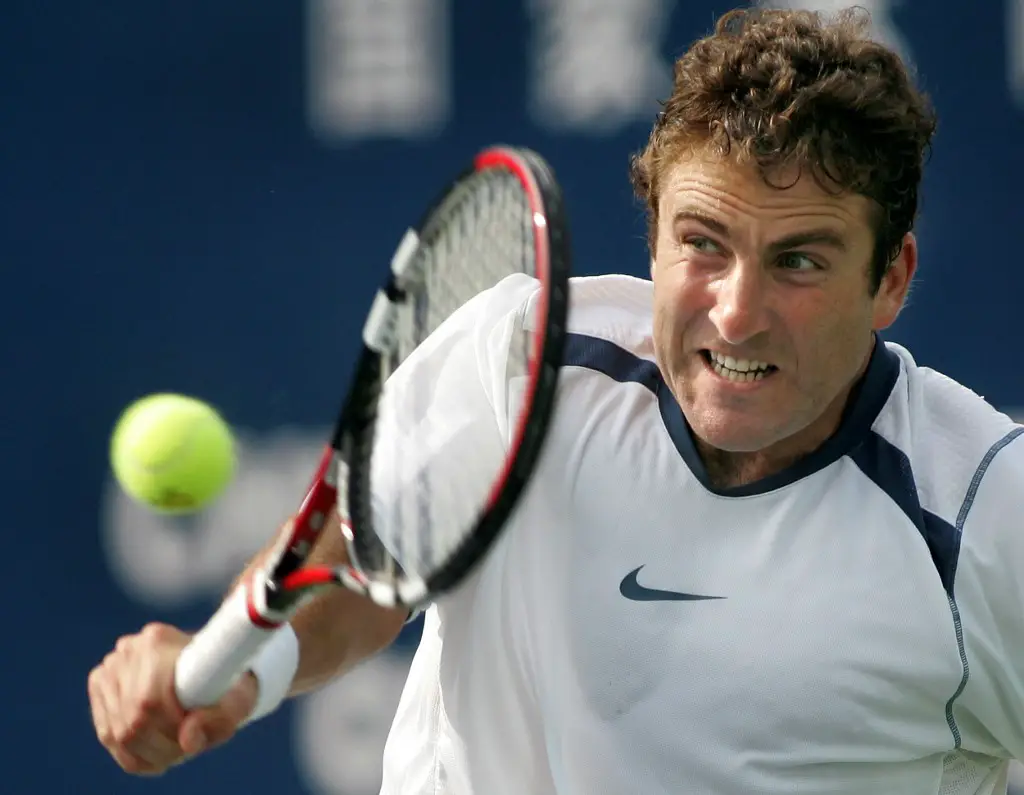 Justin Gimelstob of the United States hits a backhand return against China Open top seed Rafael Nadal of Spain, 16 September 2005 in Beijing, during second round men's tennis action. Nadal came from behind to defeat Gimelstob 5-7, 6-4, 6-4 to advance to the next round. AFP PHOTO/Frederic J. BROWN (Photo by FREDERIC J. BROWN / AFP)
