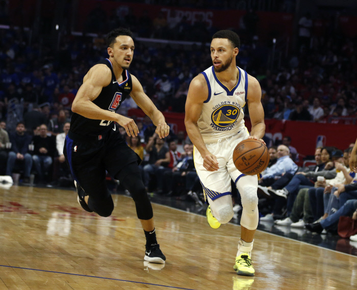 April 21, 2019 - Los Angeles, California, U.S - Golden State Warriors' Stephen Curry (30) drives last Los Angeles ClippersÀ Landry Shamet (20) during an NBA basketball playoffs round one game between Los Angeles Clippers and Golden State Warriors Sunday, April 21, 2019, in Los Angeles. The Warriors won 113-105.