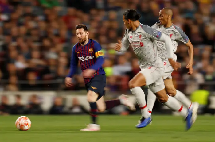 Soccer Football - Champions League Semi Final First Leg - FC Barcelona v Liverpool - Camp Nou, Barcelona, Spain - May 1, 2019  Barcelona's Lionel Messi in action with Liverpool's Fabinho and Virgil van Dijk