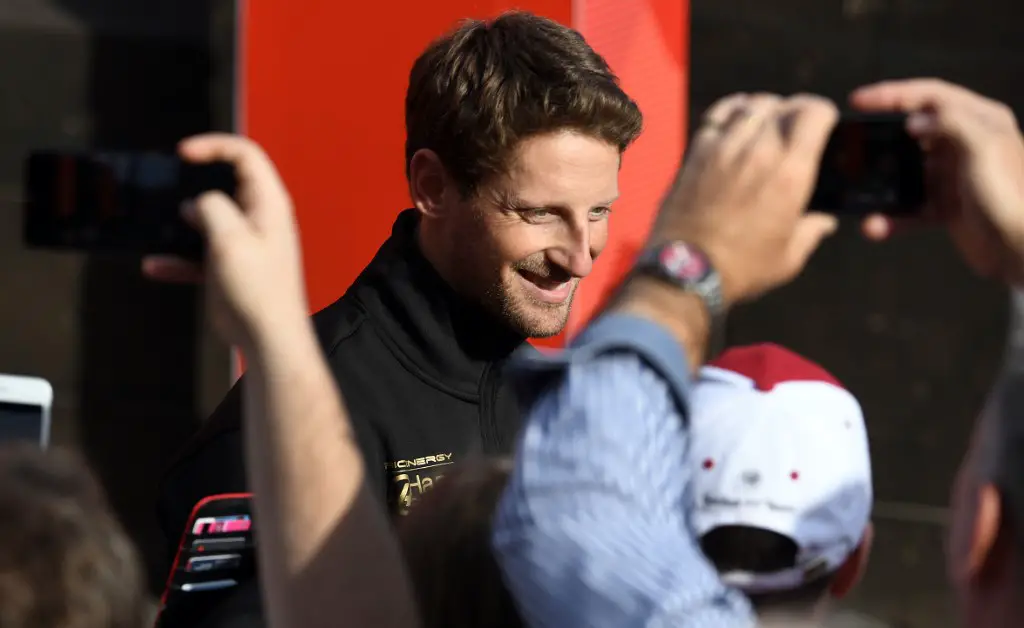 Haas F1's French driver Romain Grosjean greets fans during an F1 live event to introduce drivers and team principals in Melbourne on March 13, 2019, ahead of the Formula One Australian Grand Prix. (Photo by William WEST / AFP) / -- IMAGE RESTRICTED TO EDITORIAL USE - STRICTLY NO COMMERCIAL USE --