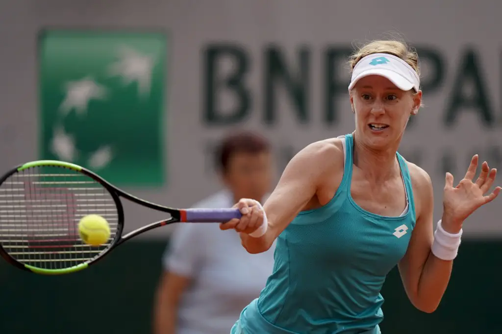 Alison Riske of the US returns the ball Germany's Andrea Petkovic during their women's singles first round match on day two of The Roland Garros 2019 French Open tennis tournament in Paris on May 27, 2019. (Photo by Kenzo TRIBOUILLARD / AFP)