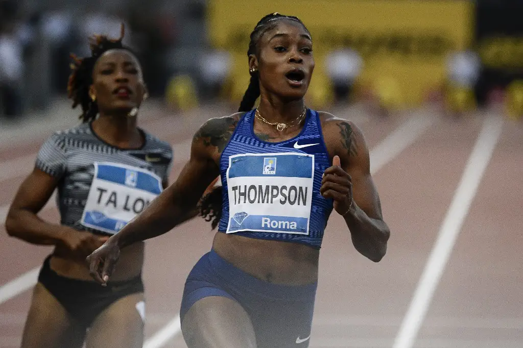 Jamaica's Elaine Thompson (C) wins the Women's 100m during the IAAF Diamond League competition on June 6, 2019 at the Olympic stadium in Rome. (Photo by Filippo MONTEFORTE / AFP)