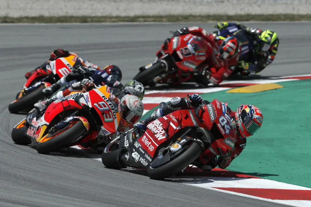 Mission Winnow Ducati's Italian rider Andrea Dovizioso (R) rides ahead of Repsol Honda Team's Spanish rider Marc Marquez during the Catalunya MotoGP Grand Prix race at the Catalunya racetrack in Montmelo, near Barcelona, on June 16, 2019. (Photo by PAU BARRENA / AFP)