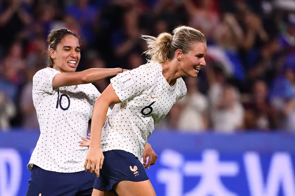 France's midfielder Amandine Henry (R) celebrates after scoring a goal during the France 2019 Women's World Cup round of sixteen football match between France and Brazil, on June 23, 2019, at the Oceane stadium in Le Havre, north western France. (Photo by FRANCK FIFE / AFP)