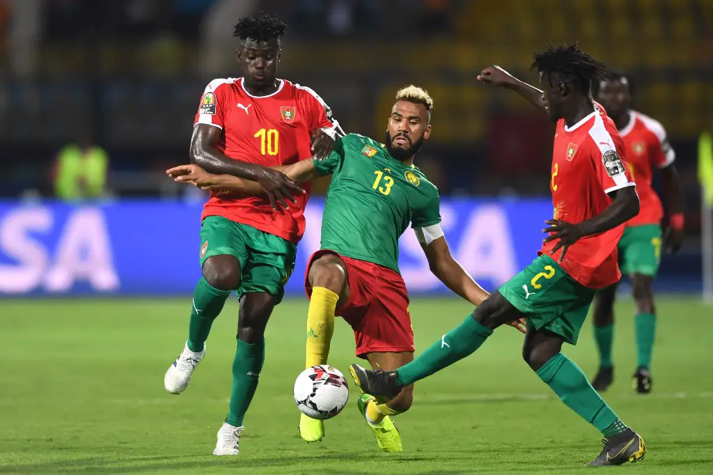 Cameroon's forward Eric Maxim Choupo-Moting (C) is marked by Guinea-Bissau's midfielder Pele (L) and Guinea-Bissau's defender Eliseu Nadjack Soares (R) during the 2019 Africa Cup of Nations (CAN) football match between Cameroon and Guinea-Bissau at the Ismailia Stadium on June 25 , 2019. (Photo by OZAN KOSE / AFP)