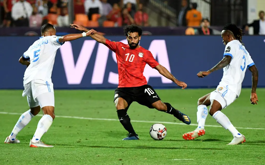 Egypt's forward Mohamed Salah (C) kicks the ball and scores a goal during the 2019 Africa Cup of Nations (CAN) football match between Egypt and DR Congo at the Cairo International Stadium on June 26, 2019. (Photo by Khaled DESOUKI / AFP)