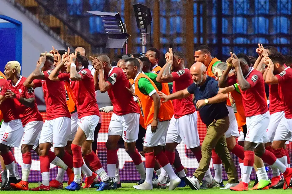 Madagascar's players celebrates after scoring their second goal  during the 2019 Africa Cup of Nations (CAN) Group B football match between Madagascar and Nigeria at the Alexandria  Stadium on June 30, 2019. (Photo by Giuseppe CACACE / AFP)