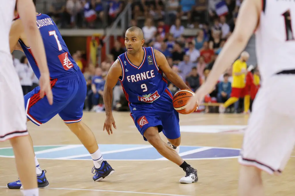 France's point guard Tony Parker runs with the ball during the basketball match between France and Japan at the Kindarena hall in Rouen on June 28, 2016. (Photo by CHARLY TRIBALLEAU / AFP)
