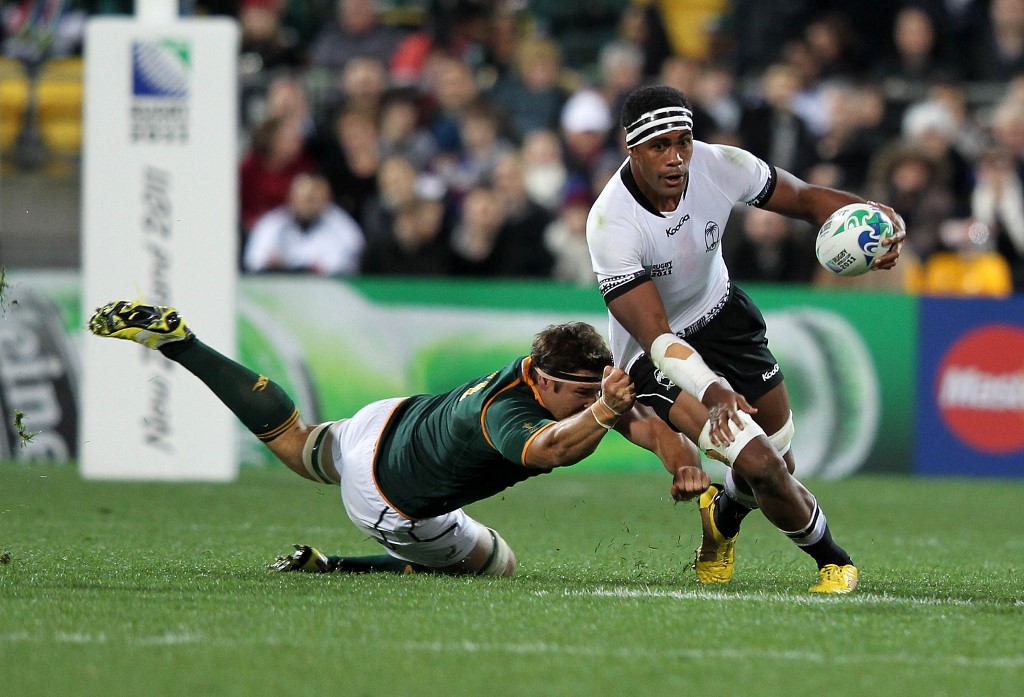 Dominiko Maiwiriwiri Waqaniburotu of Fiji is tackled by Willem Alberts of South Africa's Springbok during the 2011 Rugby World Cup pool D match of South Africa vs Fiji at the Wellington Regional Stadium in Wellington on September 17, 2011. AFP PHOTO / Marty Melville (Photo by Marty Melville / AFP)