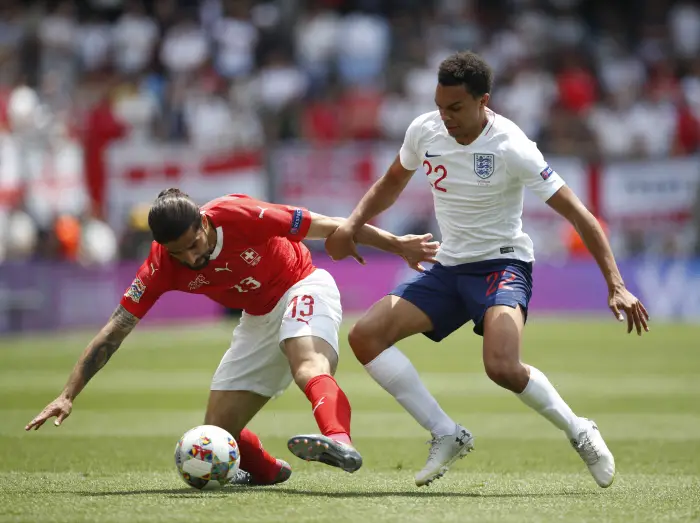 Trent Alexander-Arnold of England tackles Ricardo Rodriguez of Switzerland during the UEFA Nations League match at D. Afonso Henriques Stadium, Guimaraes. Picture date: 9th June 2019.