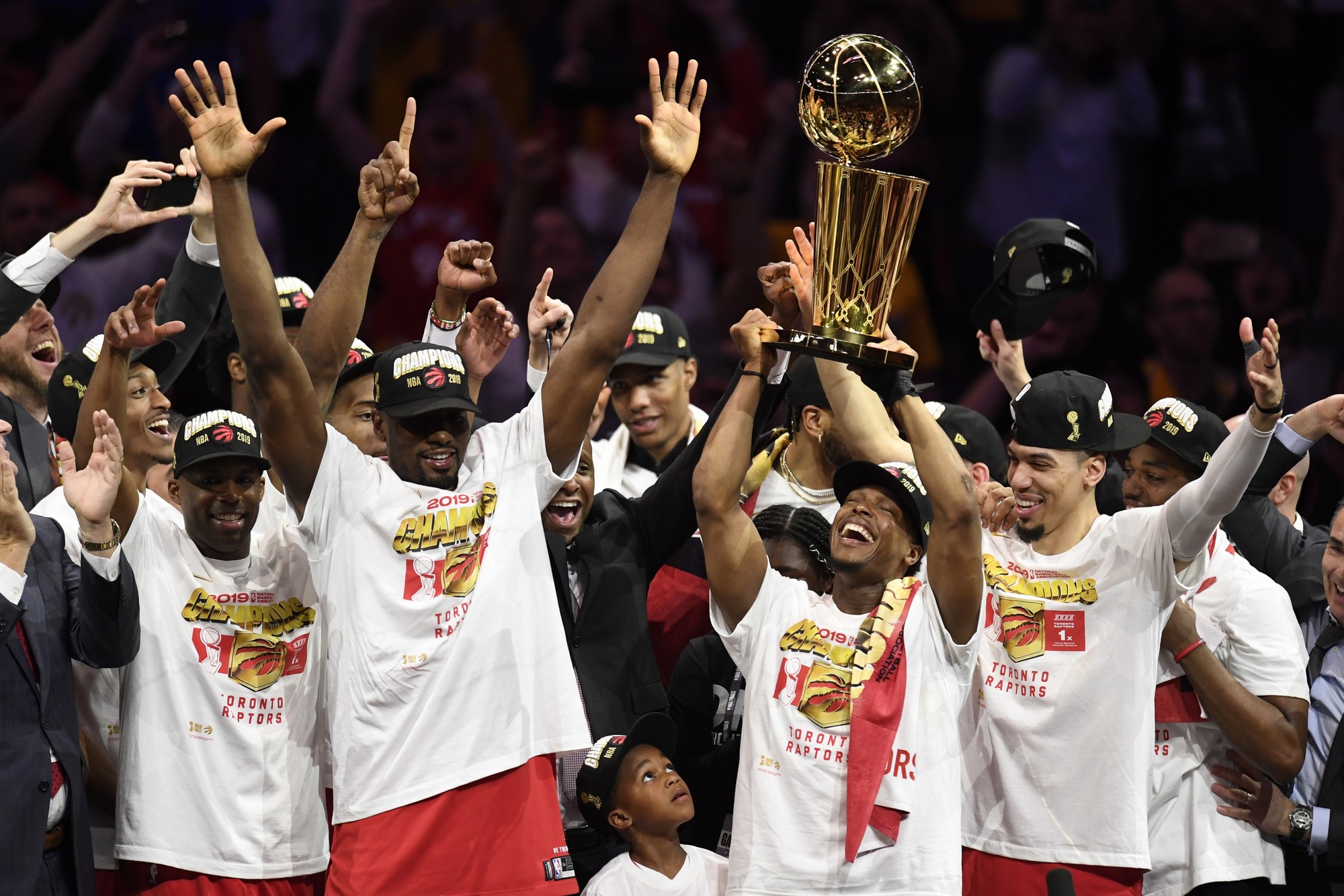 Toronto Raptors guard Kyle Lowry, centre left, holds Larry O'Brien NBA Championship Trophy after defeating the Golden State Warriors basketball action in Game 6 of the NBA Finals in Oakland, Calif. on Thursday, June 13, 2019. Raptors have won their first NBA title in franchise history. THE CANADIAN PRESS/Frank Gunn