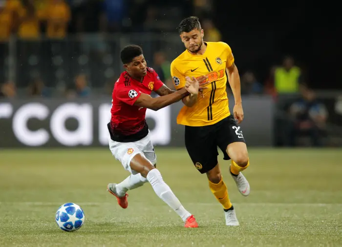 Manchester United's Marcus Rashford in action with Young Boys' Loris Benito