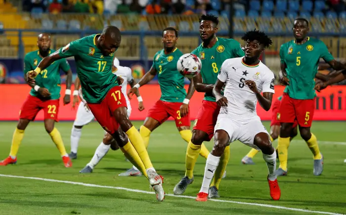 Soccer Football - Africa Cup of Nations 2019 - Group F - Cameroon v Ghana - Ismailia Stadium, Ismailia, Egypt - June 29, 2019  Cameroon's Karl Toko in action with Ghana's Thomas Partey
