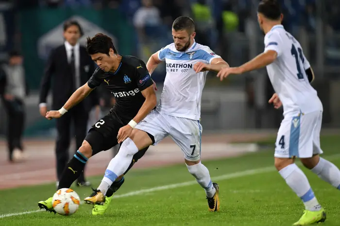 Hiroki Sakai of Marseille and Riza Durmisi of Lazio compete for the ball during the Uefa Europa League 2018/2019 football match between SS Lazio and Marseille at stadio Olimpico, Roma, November, 08, 2018