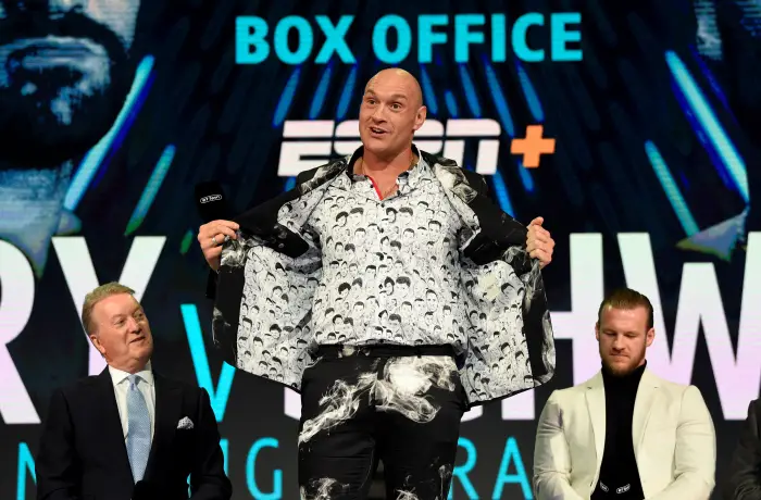 Tyson Fury, promoter Frank Warren and trainer Ben Davison during the press conference