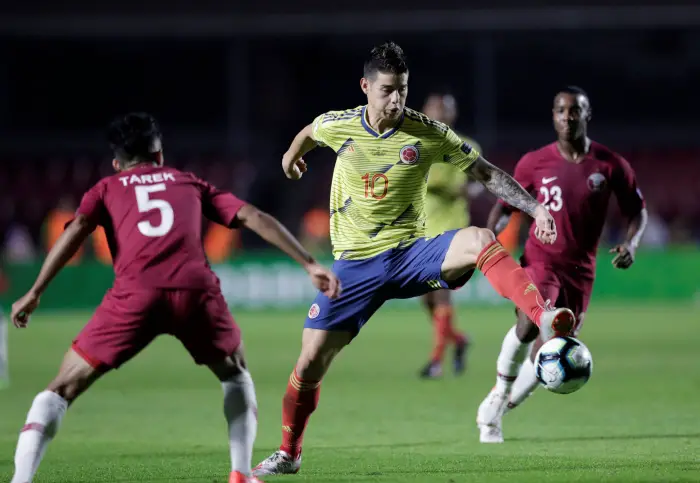 Colombia's James Rodriguez in action with Qatar's Tarek Salman