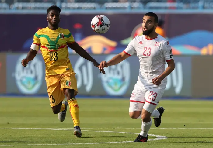 Mali's Abdoulay Diaby in action with Tunisia's Naim Sliti