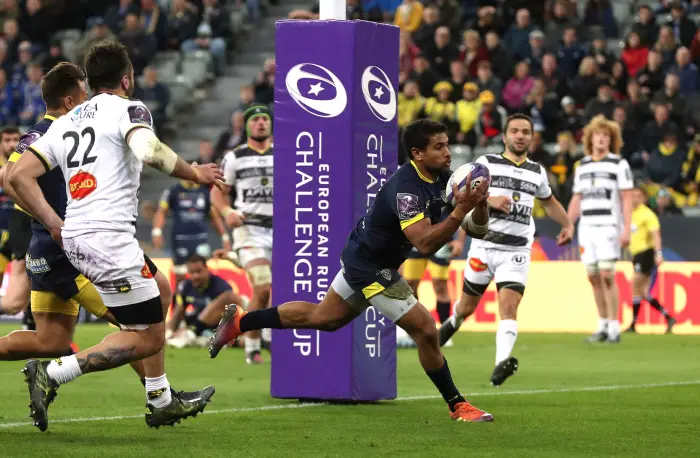ASM Clermont Auvergne's Wesley Fofana scores their third try