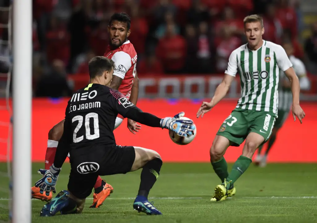 Rio Ave's Brazilian goalkeeper Leo Jardim (L) tries to stop a ball from Sporting Braga's Brazilian forward Dyego Sousa beside Rio Ave's Croatian midfielder Nikola Jambor (R) during the Portuguese league football match between Sporting CP and Rio Ave FC at the Jose Alvalade stadium in Lisbon on October 6, 2018. (Photo by MIGUEL RIOPA / AFP) / The erroneous mention[s] appearing in the metadata of this photo by MIGUEL RIOPA has been modified in AFP systems in the following manner: [Rio Ave's Brazilian goalkeeper Leo Jardim (L) tries to stop a ball from Sporting Braga's Brazilian forward Dyego Sousa beside Rio Ave's Croatian midfielder Nikola Jambor (R) ] instead of [Rio Ave's Brazilian goalkeeper Leo Jardim (L) stops a shot by Sporting Braga's Brazilian forward Dyego Sousa (R) beside Rio Ave's Bissau-Guinean defender Eliseu Nadjack]. Please immediately remove the erroneous mention[s] from all your online services and delete it (them) from your servers. If you have been authorized by AFP to distribute it (them) to third parties, please ensure that the same actions are carried out by them. Failure to promptly comply with these instructions will entail liability on your part for any continued or post notification usage. Therefore we thank you very much for all your attention and prompt action. We are sorry for the inconvenience this notification may cause and remain at your disposal for any further information you may require.
