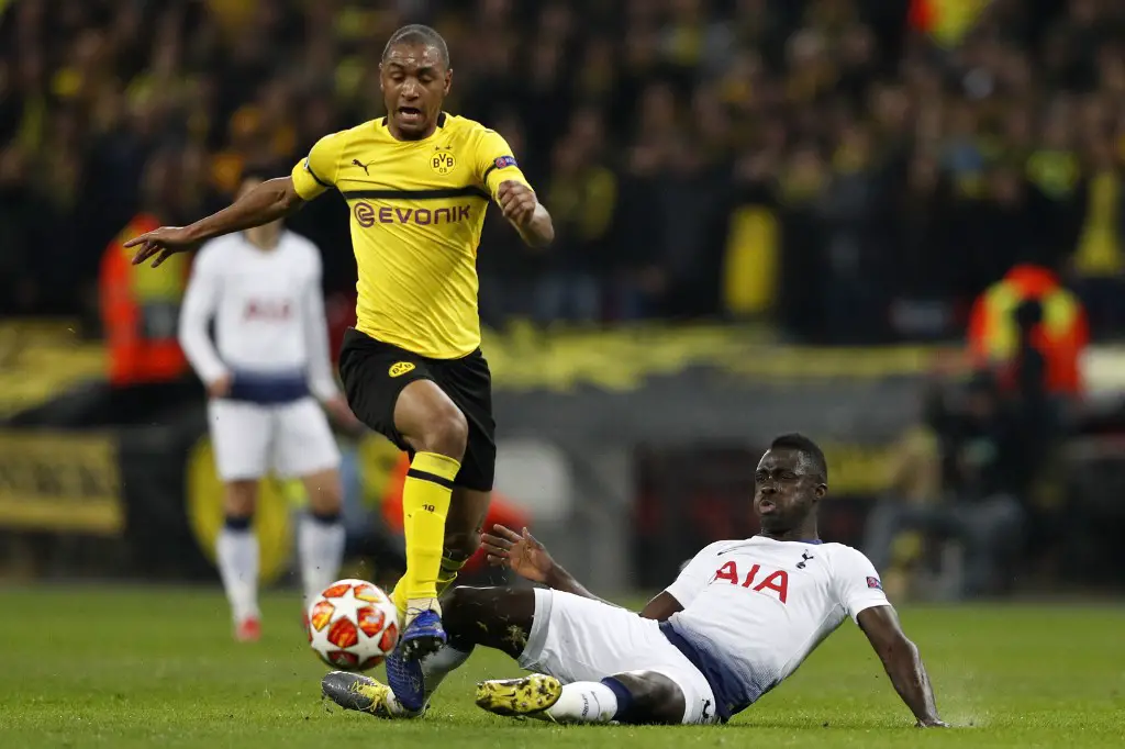 Dortmund's French defender Abdou Diallo (L) is tackled by Tottenham Hotspur's Colombian defender Davinson Sanchez (R) during the UEFA Champions League round of 16 first leg football match between Tottenham Hotspur and Borussia Dortmund at Wembley Stadium in London on February 13, 2019. (Photo by Adrian DENNIS / AFP)