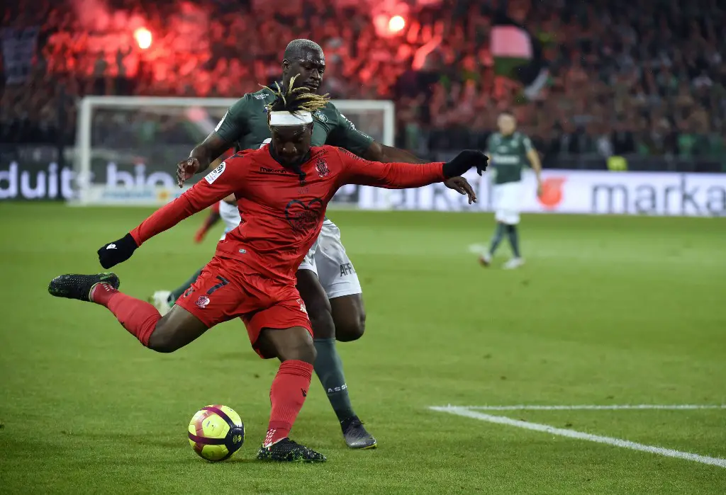 Nice's French midfielder Allan Saint-Maximin (L) vies with Saint-Etienne's French midfielder Yannis Salibur (R) during   the French L1 football match between Saint-Etienne (ASSE) and Nice (OGCN) on May 18, 2019, at the Geoffroy Guichard Stadium in Saint-Etienne, central France. (Photo by JEAN-PHILIPPE KSIAZEK / AFP)