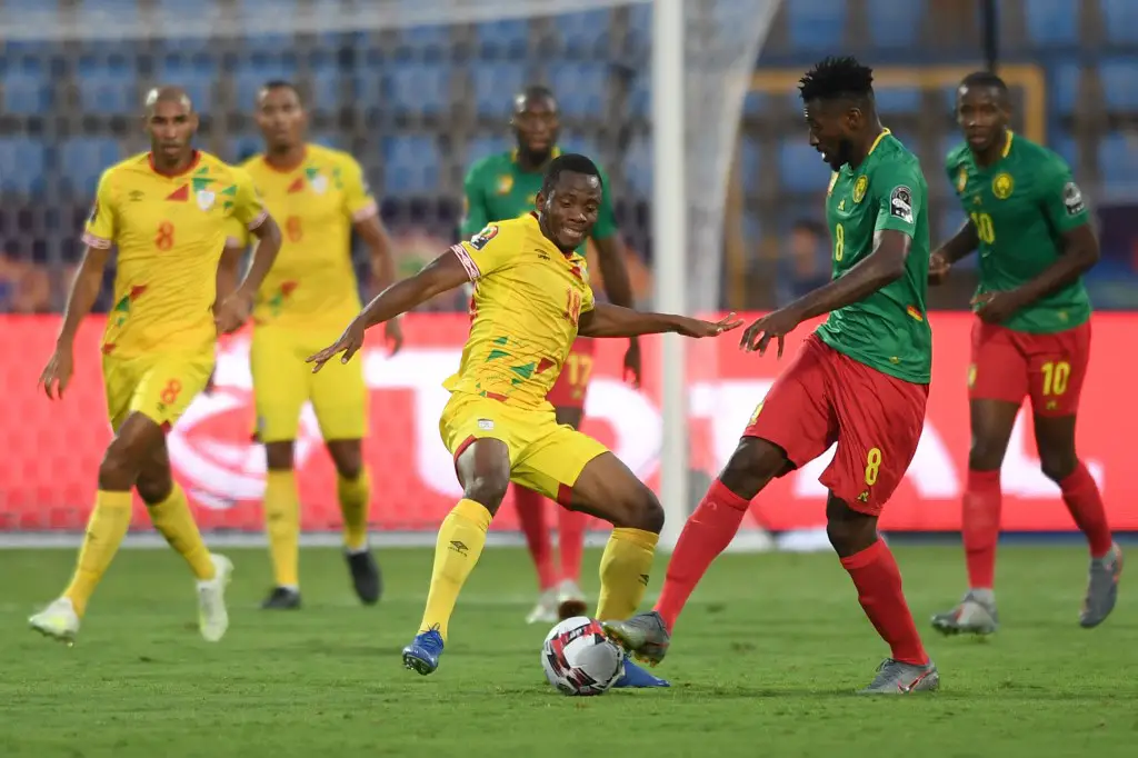 Benin's midfielder Mama Seibou (L) fights for the ball with Cameroon's midfielder Andre-Frank Zambo Anguissa during the 2019 Africa Cup of Nations (CAN) Group F football match between Benin and Cameroon at the Ismailia Stadium in the north-eastern Egyptian city on July 2, 2019. (Photo by OZAN KOSE / AFP)