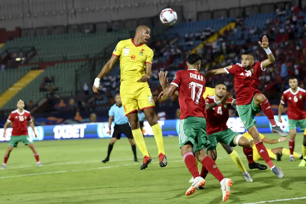 Benin's midfielder Jordan Adeoti heads the ball during the 2019 Africa Cup of Nations (CAN) Round of 16 football match between Morocco and Benin at the Al-Salam Stadium in the Egyptian capital Cairo on July 5, 2019. (Photo by Khaled DESOUKI / AFP)