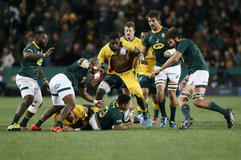 Australia's Isi Naisarani (Up C) and South Africa's Herschel Jantjies (Bottom C) fight for the ball during the 2019 Rugby Championship match, South Africa v Australia, at the Emirates Airline Park in Johannesburg, on July 20, 2019. (Photo by PHILL MAGAKOE / AFP)