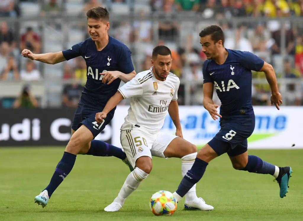 (L-R) Tottenham's Argentinian defender Juan Foyth, Madrid's Belgian midfielder Eden Hazard and  Tottenham Hotspur's English midfielder Harry Winks vie for the ball during the Audi Cup football match between Real Madrid and Tottenham Hotspur in Munich, on July 30, 2019. (Photo by Christof STACHE / AFP)