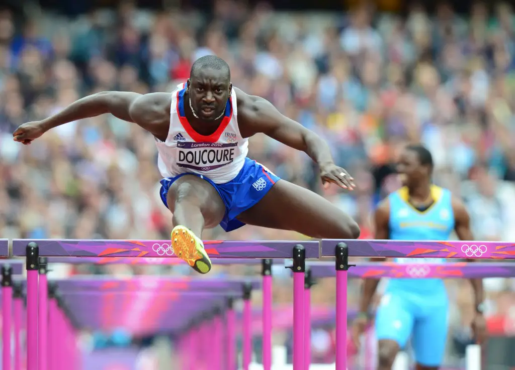 France's Ladji Doucoure competes in the men's 110m hurdles heats at the athletics event during the London 2012 Olympic Games on August 7, 2012 in London.  AFP PHOTO / OLIVIER MORIN (Photo by OLIVIER MORIN / AFP)