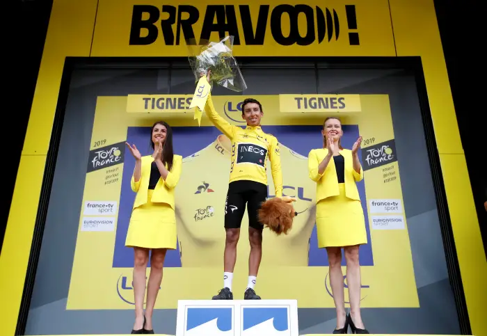 Cycling - Tour de FranceH The 1H.5-km Stage 19 from Saint-Jean-de-Maurienne to Tignes - July 26, 2019 - Team INEOS rider Egan Bernal of Colombia celebrates on the podium, wearing the overall leader's yellow jersey.