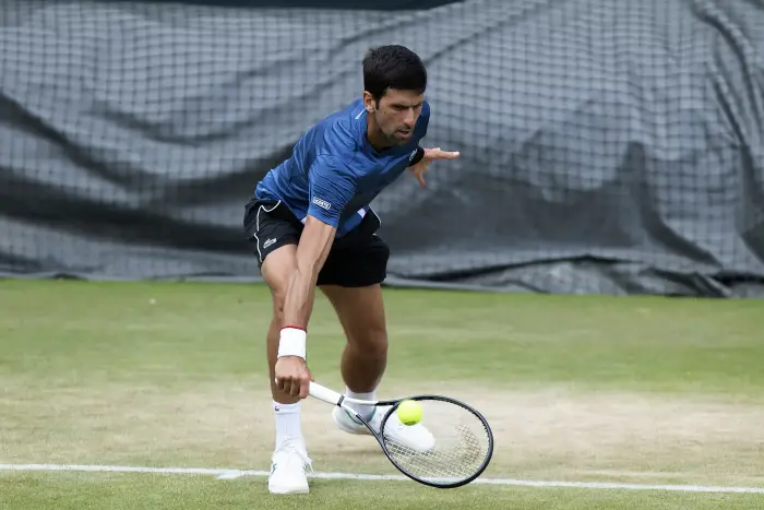 30th June 2019,The All England Lawn Tennis and Croquet Club, London, England; Wimbledon tennis tournament preview day; Novak Djokovic (SRB) with a drop shot during practice on Sunday