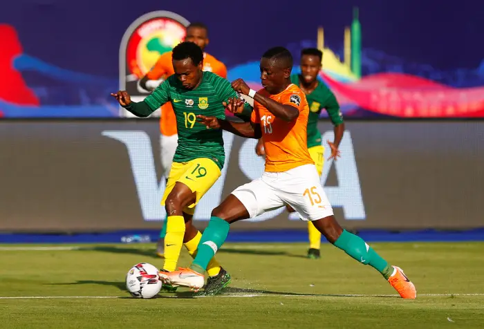 Soccer Football - Africa Cup of Nations 2019 - Group D - Ivory Coast v South Africa - Al Salam Stadium, Cairo, Egypt - June 24, 2019  Ivory Coast's Max Gradel in action with South Africa's Percy Tau