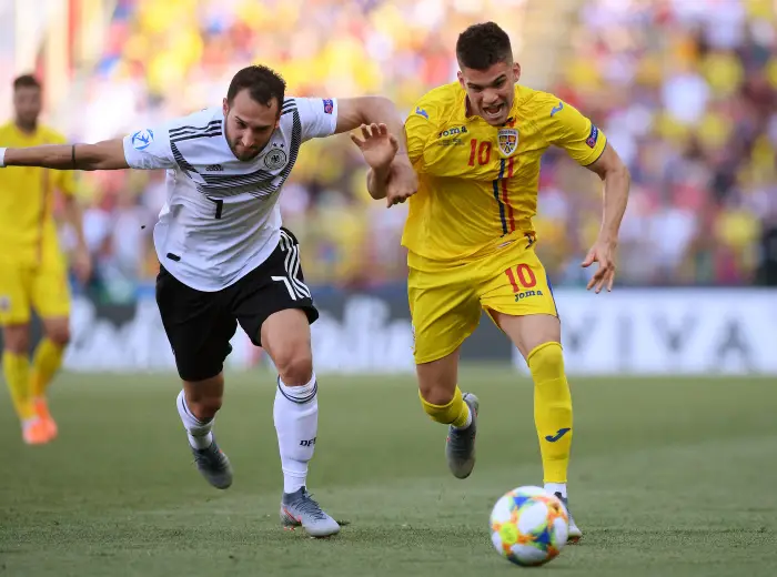 Soccer Football - 2019 UEFA European Under-21 Championship - Semi Final - Germany v Romania - Stadio Renato Dall'Ara, Bologna, Italy - June 27, 2019   Romania's Ianis Hagi in action with Germany's Levin Oztunali