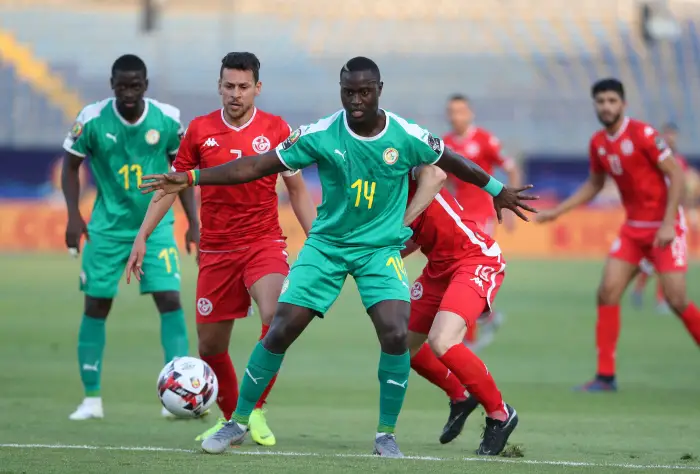 Soccer Football - AfricaHup of Htions 2019 - Semi-Final - Senegal v Tunisia - 30 June Stadium, Cairo, Egypt - July 14, 2019  Senegal's Henri Saivet in action with Tunisia's Ayman Ben Mohamed