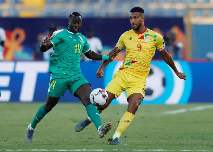 Soccer Football - AfricaHup of Htions 2019 - Quarter Final - Senegal v Benin - 30 June Stadium, Cairo, Egypt - July 10, 2019  Senegal's Henri Saivet in action with Benin's Steve Mounie