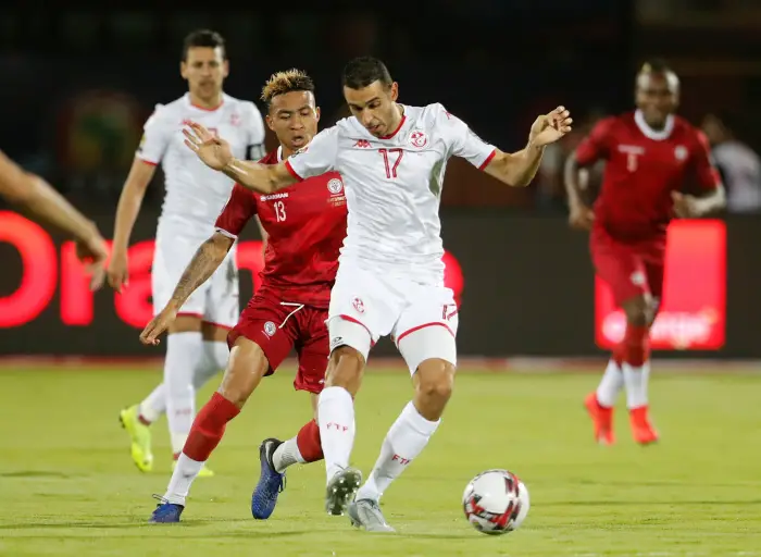 Soccer Football - AfricaHup of Htions 2019 - Quarter Final - Madagascar v Tunisia - Al Salam Stadium, Cairo, Egypt - July 11, 2019  Tunisia's Ellyes Skhiri in action with Madagascar's Anicet Abel