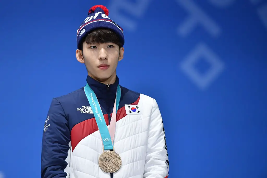 South Korea's bronze medallist Lim Hyojun poses on the podium during the medal ceremony for the short track Men's 500m at the Pyeongchang Medals Plaza during the Pyeongchang 2018 Winter Olympic Games in Pyeongchang on February 23, 2018. (Photo by Dimitar DILKOFF / AFP)